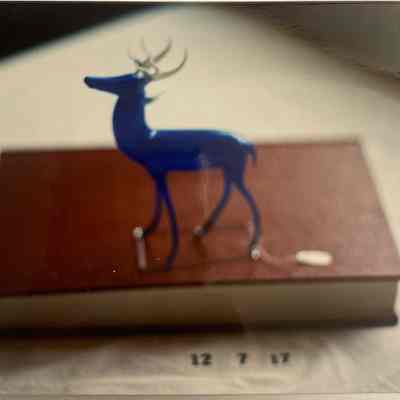Glass figurine of blue deer