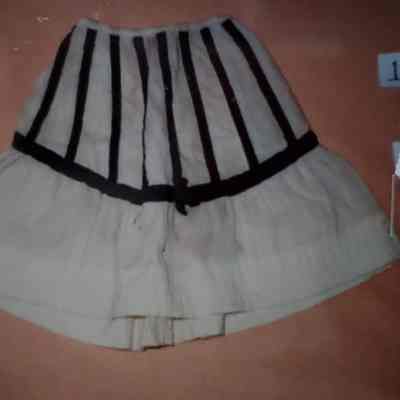Cream Colored Wool Petticoat with Applied Strips of Black Velvet Ribbon Outlining the Top of the Skirt