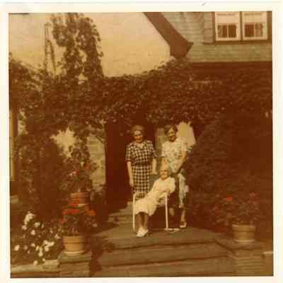 PH-1204b- Adeline Rugen and group in garden 1951