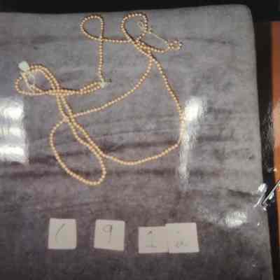 Four strand pearl necklace