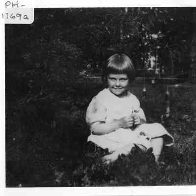 PH-1169a-A young Jeanette Rugen making a daisy chain