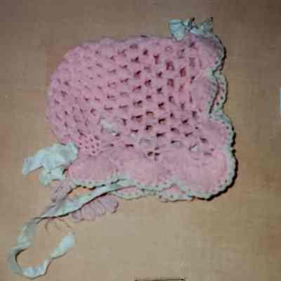 Bonnet of Pink Crocheted Yarn, Bow Trim, Satin Ribbon Chin Ties