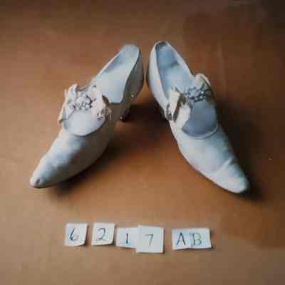 Lady's White Kid Shoes with Bow and Metal Ornament Sewn to Strap Over Instep