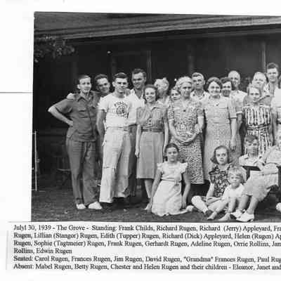 PH-1196-Rugen Family and Fannie Rugen, July 1939: The Grove - Frank Childs, Richard Rugen, Richard (Jerry) Appleyard, Frank Appleyard, Jeanette (Rugen) Childs, Fred Rugen, Sophie (Tagtmeier) Rugen, Frank Rugen, Gerhardt Rugen, Adeline Rugen, Orrie Rollins, James (Bid) Appleyard, Roba (Appleyard) Rollins, Edwin Rugen, Carol Rugen, Frances Rugen, Jim Rugen, David Rugen, "Grandma" Frances Rugen, Paul Rugen.
