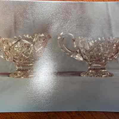 Cut glass pitcher and sugar bowl