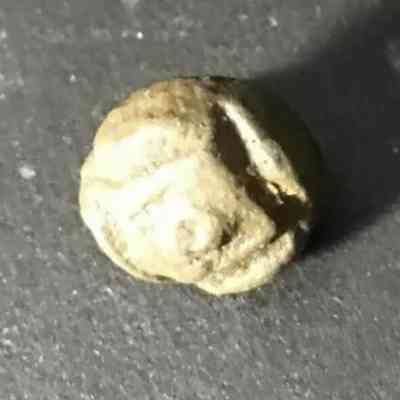 cast, brass-alloy doublet button