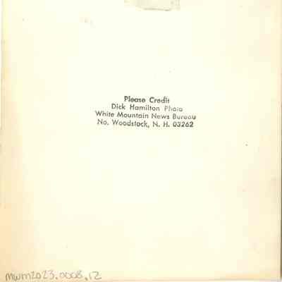 Back of photograph with Dick Hamilton's stamp.