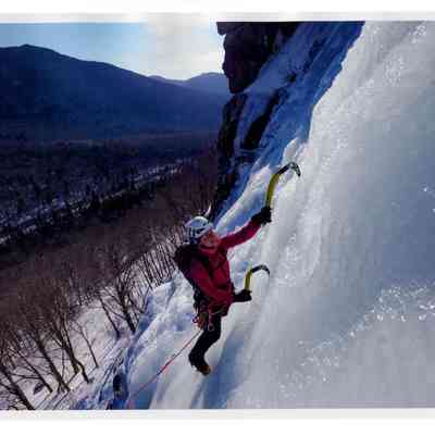 Ice Climber On Cliff