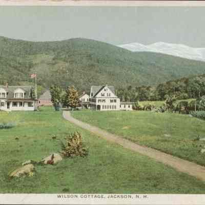 Dirt Road Leading to Cottages in the Mountains