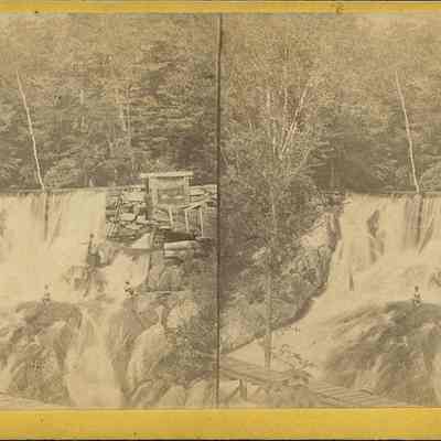 Footbridge over a Dam and Waterfall