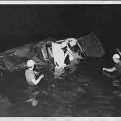 Rescue Workers Surveying Wreck