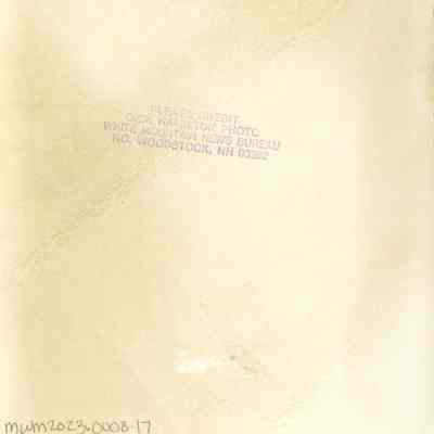 Back of photograph with Dick Hamilton's stamp.