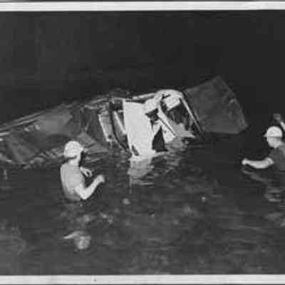 Rescue Workers Surveying Wreck