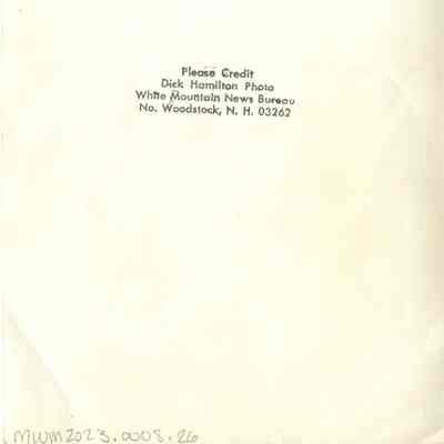 Back of photograph with Dick Hamilton's stamp.