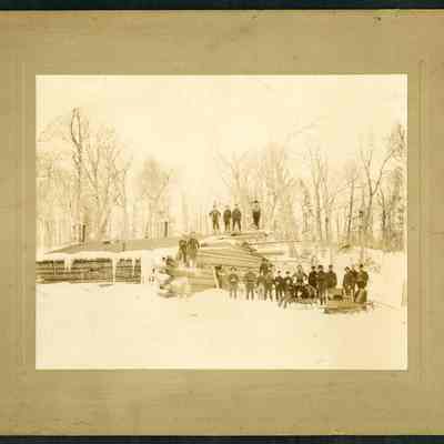 Men by a Log Building