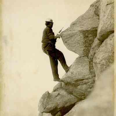 Individual repelled off of Cannon Cliff on The Old Man of the Mountain