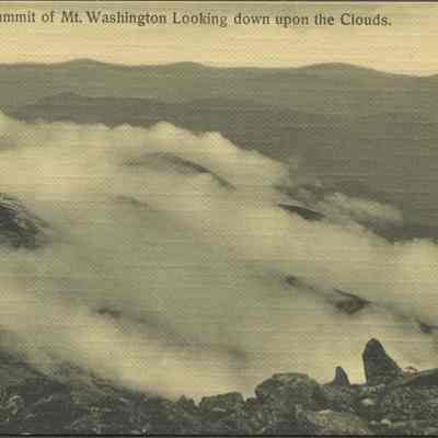 On the summit of Mt. Washington looking down upon the clouds
