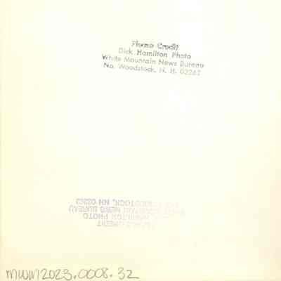 Back of photograph with 2 of Dick Hamilton's stamps and another inscription in pen at the upper left.