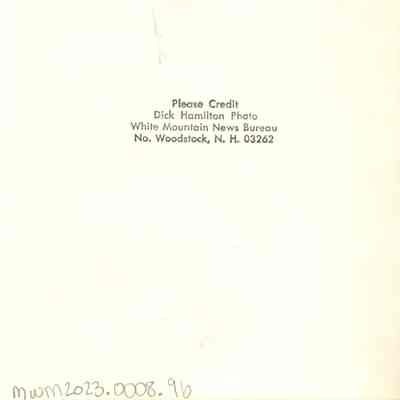 Back of photograph with Dick Hamilton's stamp.