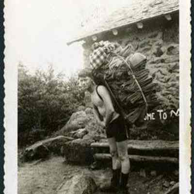 Unidentified Hiker Packing Blankets Out of Madison Hut