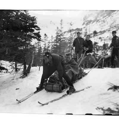 Henry "Swampy" Paris Skiing an Injured Skier out from Hermit Lake