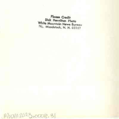 Back of photograph with Dick Hamilton's stamp.
