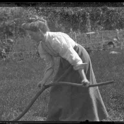 Woman Cutting Grass