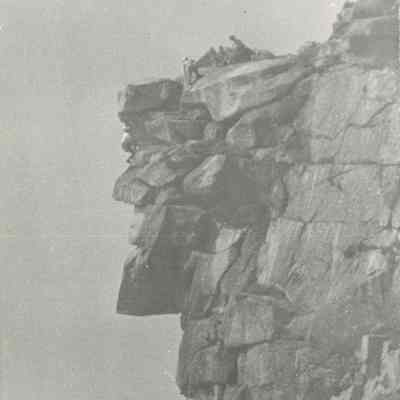 Workers atop The Old Man of the Mountain