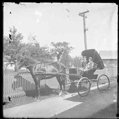 Two Boys in a Horse Drawn Carriage