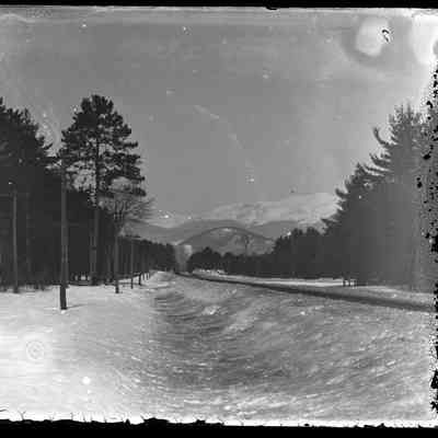 Railroad and Snow-Covered Mtns