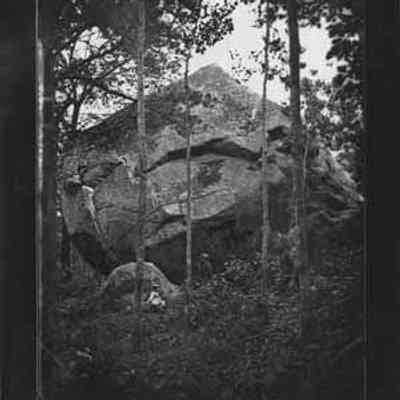 Man and Woman by a Boulder