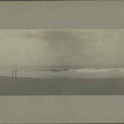 Two People Walking the Beach