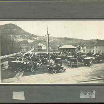 Automobiles by Flagpole