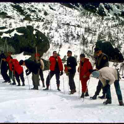 NH Fish & Game Officers and Vounteers in a Probe Line Searching for Buried Avalanche Victim in Huntington Ravine