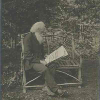 T. E. M. White Reading a Newspaper