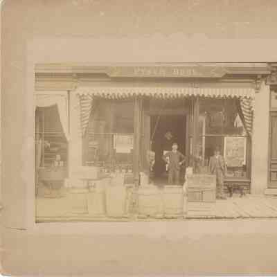 Pynch Bros. 100 block east on the Square. c 1890