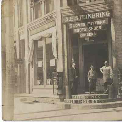 Postcard A.E. Steinbring's Corner Shoe Store. c.1920s