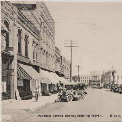 Postcard of 200 Watson block looking north