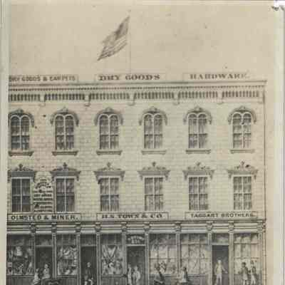 Card showing three-story building 100 block west side of Square