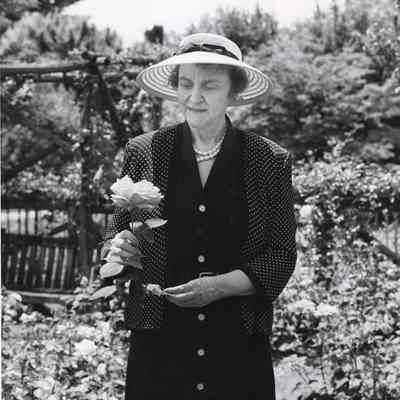 Coe_Caroline_008: Caroline Coe holding rose at Planting Fields