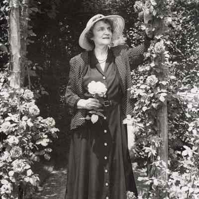 Coe_Caroline_009: Caroline Coe holding rose at Planting Fields