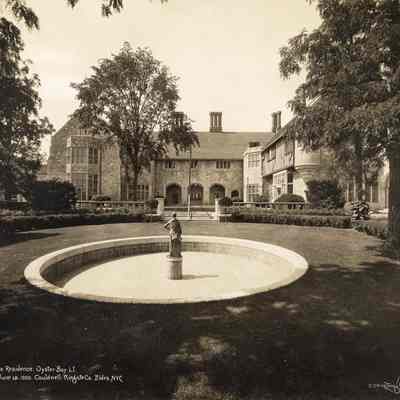 CH_Ext_002: Coe Hall and circular pool under construction, photographed by Irving Underhill