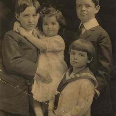 Coe_Family_011: Portrait of William Rogers Coe, Robert D. Coe, Henry H.R. Coe, and Natalie Coe