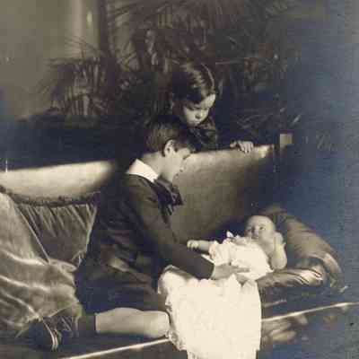 Coe_Family_012: Portrait of William Rogers Coe and Robert D. Coe looking at Henry H.R. Coe as a baby