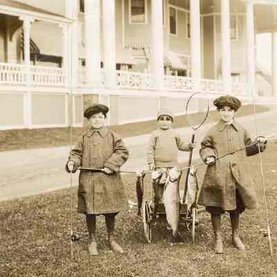 Coe_Family_014: William Rogers Coe, Henry H.R. Coe, and Robert D. Coe  with fishing gear and dead fish