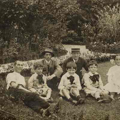 Coe_Family_016: William Rogers Coe and Robert D. Coe sitting with Dallas Pratt, Cynthia Pratt, Joe Gannon, and two other unknown men at Planting Fields