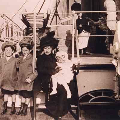 Coe_Family_018: William Rogers Coe, Robert D. Coe, and Natalie Coe with Mai Coe on ship
