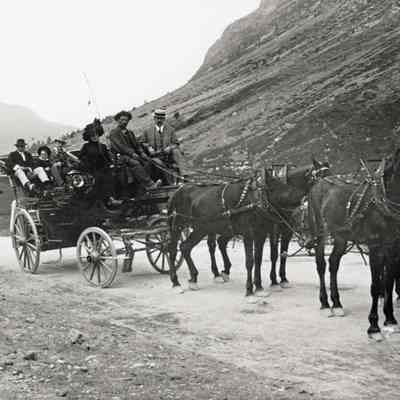 Coe_Family_019: Mai Coe in a carriage with unknown men and two children