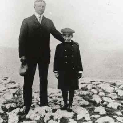 Coe_Family_024: W.R. Coe with William Rogers Coe in front of Old Faithful geyser at Yellowstone National Park