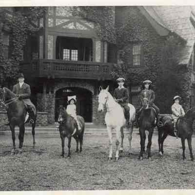 Coe_Family_026: W.R. Coe, Natalie Coe, William Rogers Coe, Robert D. Coe, and Henry H.R. Coe on horseback at Planting Fields